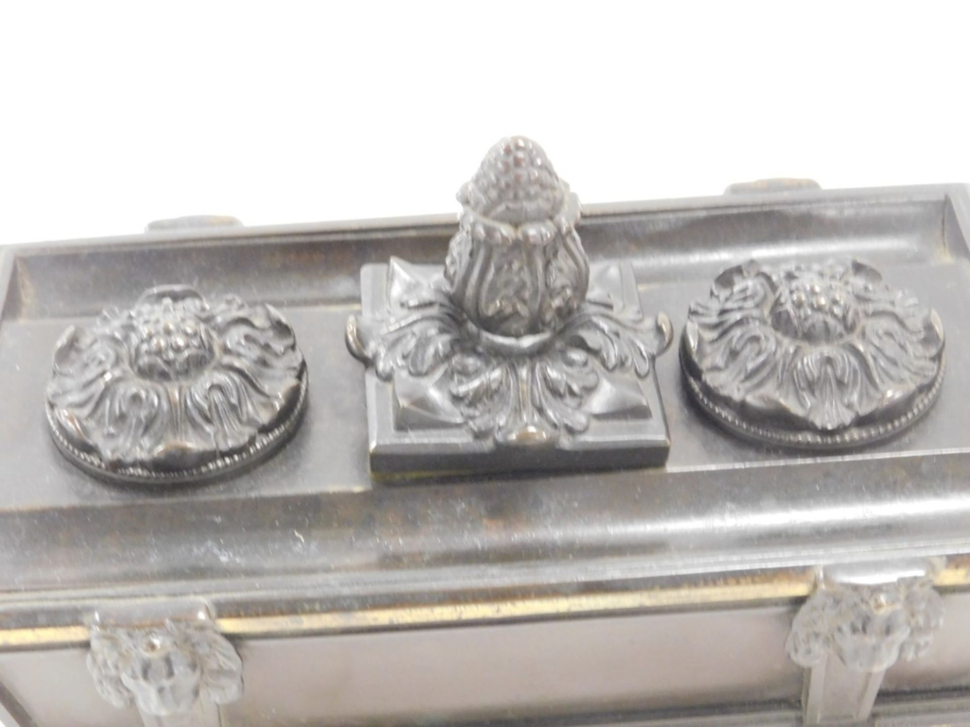 A late 19thC bronze desk stand, formed as a sarcophagus, with twin ring handles, the top with a cent - Image 2 of 4