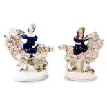 A pair of mid 19thC Staffordshire figures, modelled as the Prince and Princess of Wales, seated upon