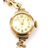 A mid century Hefik 9ct gold cased wristwatch, circular champagne dial bearing Arabic numerals on a