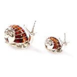 Two Saturno silver and enamelled snails, each marked 925, 2.8cm and 2cm high.