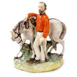 A late 19thC Staffordshire flatback figure group modelled as Garibaldi, modelled standing against hi