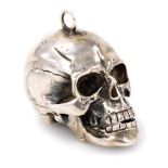 A 19thC French pendant watch by L Epine of Paris, in white metal memento mori hinged skull case, wi