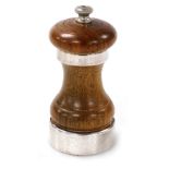 An Elizabeth II turned wooden and silver mounted pepper pot, London 1958, 10.5cm high.