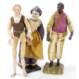 Three late 19thC Continental figures, comprising a carved wooden figure of a lady in a silk dress, r