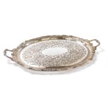 A Victorian silver plated twin handled tray, of oval form, engraved centrally with flowers and folia