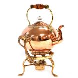 A Victorian copper and brass tea kettle, on stand, with burner, 37cm high.