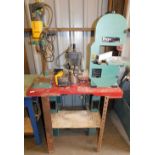 A work bench mounted with various bench tools, comprising a Matabo pillar drill, a Ferm Flz-275 band