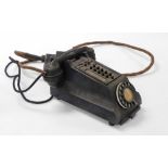 A mid century Bakelite intercom telephone, in black.