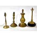 Four brass table lamps, variously cast, 30cm high (2), 35cm high and 38cm high.