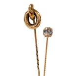 A Victorian paste set tie pin, stamped 15, 1.4g, and a double loop tie pin, yellow metal, 2.5g. (2)