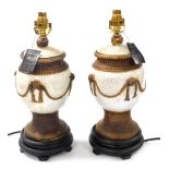 A pair of Chinese crackle glaze cream and buff table lamps, on socle bases, 42cm high.