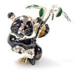 A Saturno silver and enamelled model of a koala bear, holding bamboo shoots, marked 925, 3.5cm high.