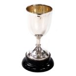 A Victorian silver cup, of plain form, with black socle, James Deakin & Sons, Sheffield 1894, 3.63oz