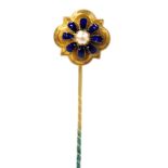 A Victorian tie pin, of floral form, with a central cultured pearl in a blue enamel surround, in yel