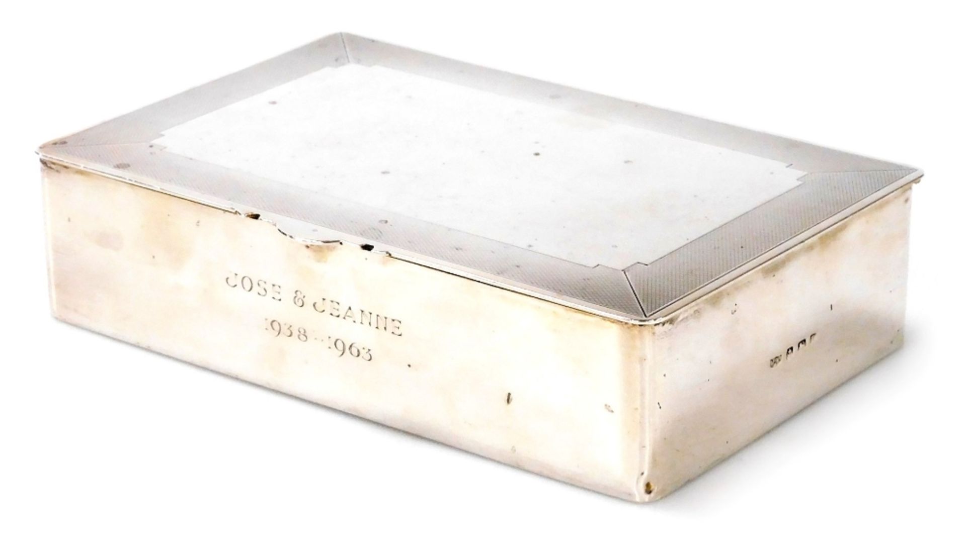 A George V silver cigar box, the lid with engine turned decoration, the body engraved Jose and Jeann