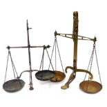 A pair of late 19thC cast iron brass scales, 50cm high, together with a further pair of brass scales