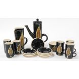 A Stuart Bass Studio pottery part coffee set, decorated with leaves against a green ground, with a c