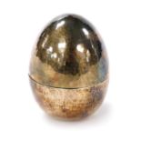 An Elizabeth II silver egg, with a hammered, faceted finish, William A Fipps, London 1975, 2.5oz, 5.