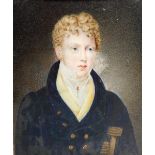 An early 19thC portrait miniature of a gentleman, half length, seated in a chair, in a red Morocco l