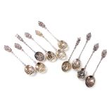 A set of eight Continental white metal souvenir spoons, each bowl cast with a study of a church, and