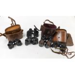 A pair of Bausch and Lomb American military binoculars, three further pairs of binoculars, and pair