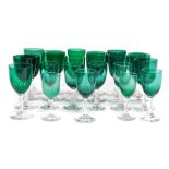 A group of Edwardian green glass wine and spirit glasses. (a quantity)
