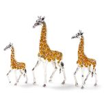 Three Saturno silver and enamelled models of giraffes, each in standing position, 11cm, 9cm and 7cm