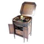 An early 20thC Gilbert oak cased cabinet gramophone, for A Hinkins and Son, Retford, the hinged lid