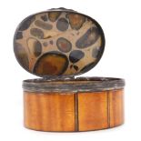 A Victorian satinwood and agate snuff box, of oval form, with white metal mounts, contains piece of
