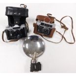 A Russian Fed4 camera, Zenit camera, and a vintage flash. (3)