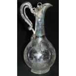 A Victorian etched glass and silver mounted claret jug, the mount decorated with applied leaves and