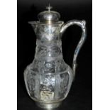 A Victorian cut glass and silver mounted claret jug, possibly Stevens and Williams, intaglio carved
