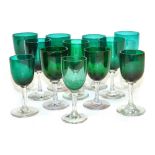 A group of Edwardian green wine glasses. (12)