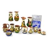 A group of Devon motto ware pottery, to include a milk jug, 7.5cm high, vases, further jugs, puzzle