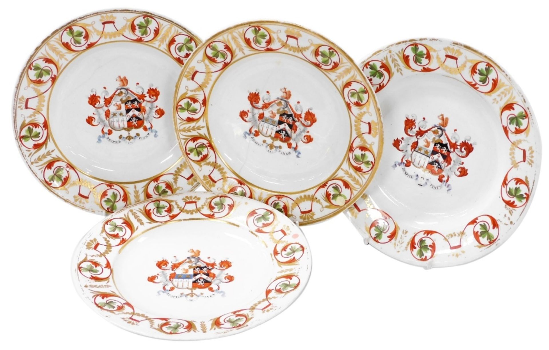 A set of four early 19thC Derby porcelain armorial plates, the central reserve decorated with the co