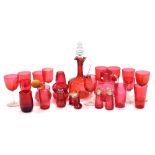 A group of Victorian and later cranberry coloured glass ware, to include drinking glasses, claret ju