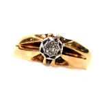 A diamond solitaire ring, illusion set, in a high claw yellow metal mount, approx 1/8 of a carat, si
