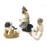 Three Nao porcelain figures, comprising a girl standing at a quayside looking out to sea, seated boy