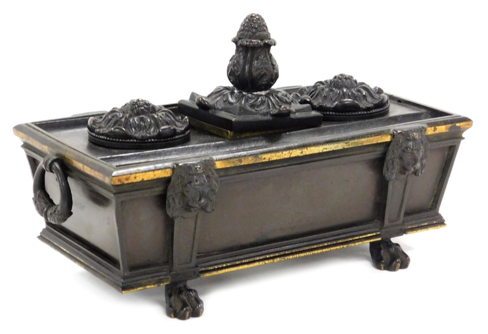 A late 19thC bronze desk stand, formed as a sarcophagus, with twin ring handles, the top with a cent