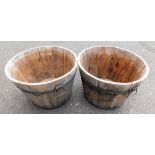 A pair of pine and coopered barrels, each 47cm diameter.