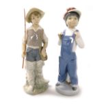 Two Lladro porcelain figures, comprising a boy in dungarees with a squeeze box, and a boy fisherman.