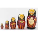 A graduated set of five Russian Matryoshka dolls, traditionally painted, largest 15cm high.