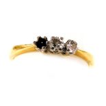 An 18ct gold and diamond three stone ring, one stone lacking, size O, 3.0g.