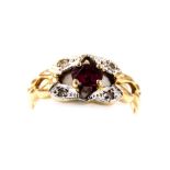 A 9ct gold ruby and diamond ring, in an abstract floral setting, size K, 1.6g.