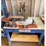 A two tier work bench mounted with various tools, comprising a Rexon belt and disc sander, a Stanley