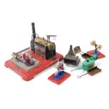 A Mamod steam engine SP4, boxed, various other steam engine parts, and an oil can.