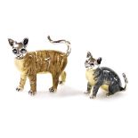 Two Saturno silver and enamelled models of cats, in standing position, 4cm high, and seated position