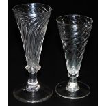 Two 18thC dwarf ale glasses, both with wrythen bowls, one with fringed collar to the base of the sli