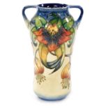 A Moorcroft pottery two handled vase decorated in the Anna Lily pattern, impressed and painted marks