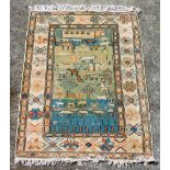 A wool rug, the rectangular central reserve decorated with figures, domestic animals, butterflies, a